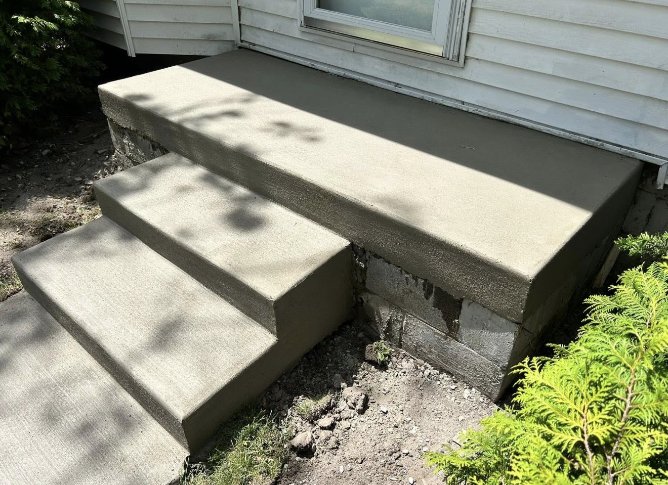 Poured concrete steps and stoop